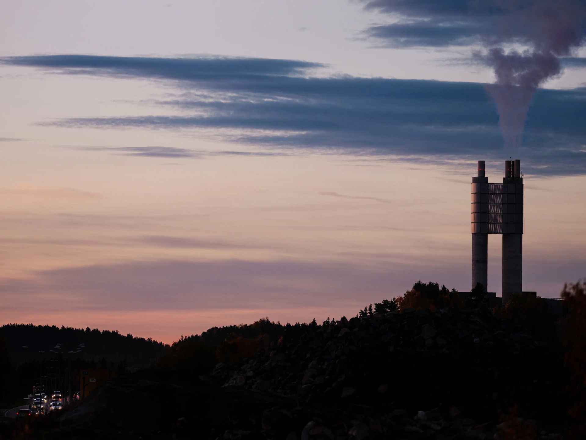 District heating tower at sunset